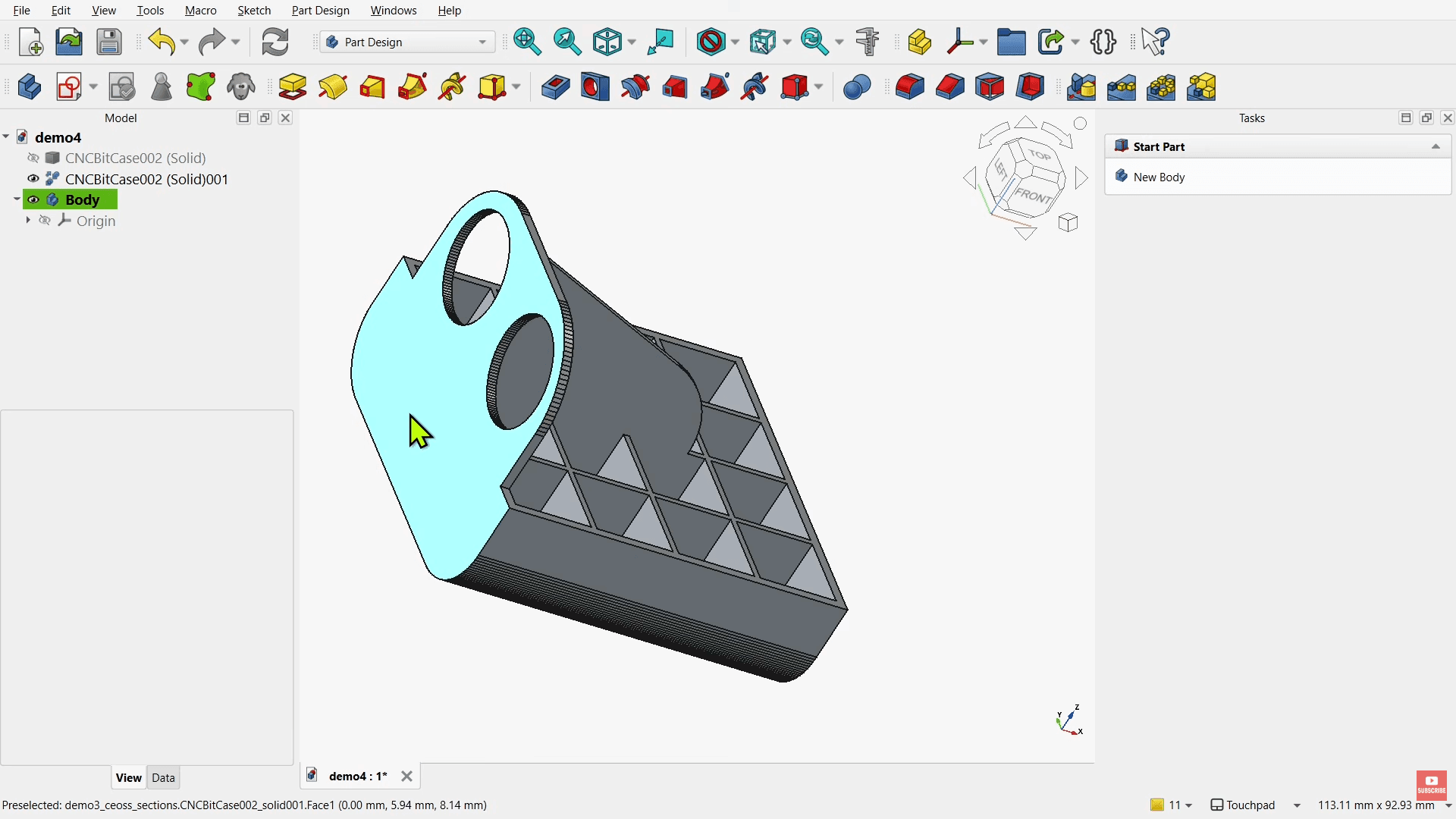FreeCAD Part Design interface showing a 3D mechanical component with circular holes, triangular supports, and a highlighted front face.