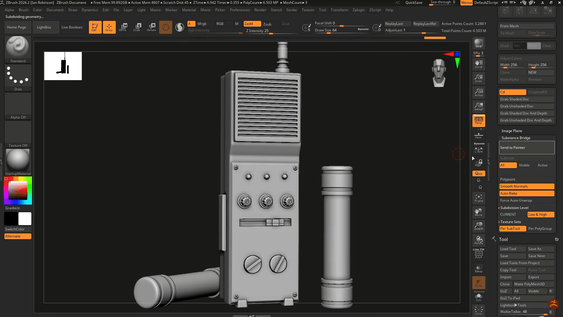 ZBrush sculpting interface displaying a detailed gray 3D model of a handheld electronic device with sculpting controls.